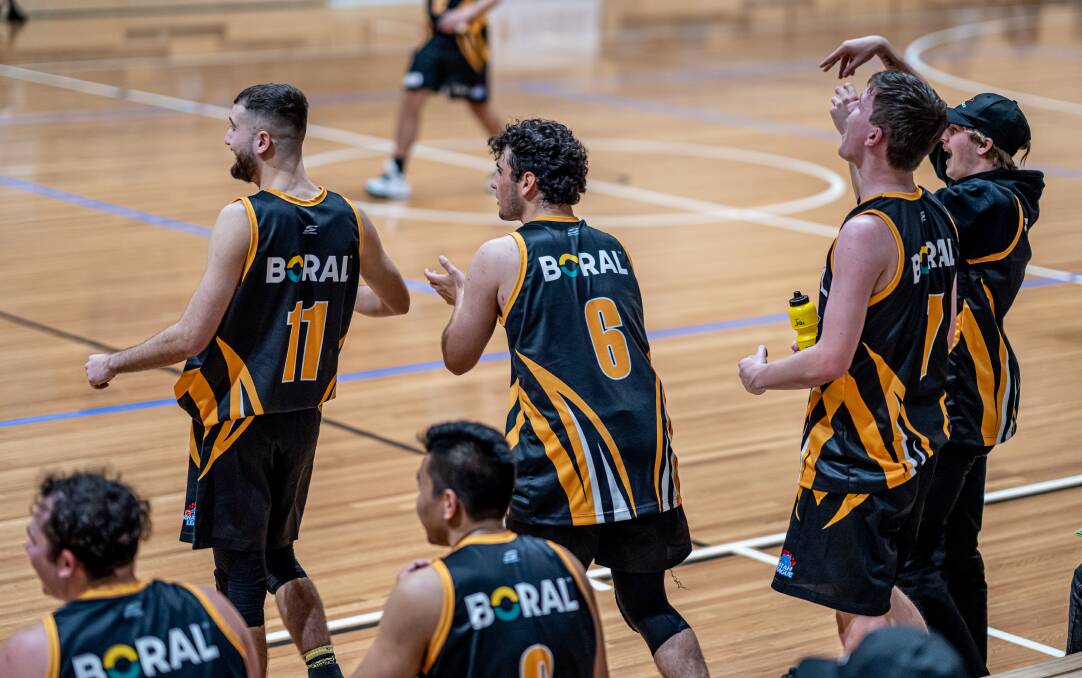 ALL SMILES: The Tigers' bench celebrating after a made basket. Picture: Shoalhaven Basketball Association. 