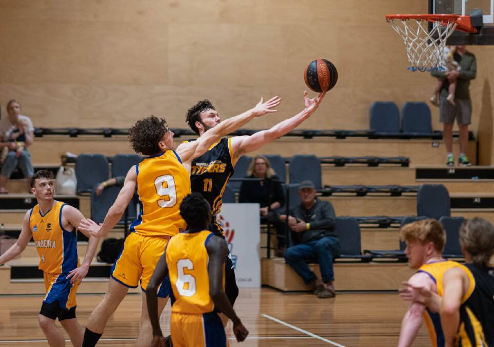 ON ATTACK: Number 11, Kyle Leslie (Pictured) attacking the rim against Canberra. Picture: Shoalhaven Basketball Association.