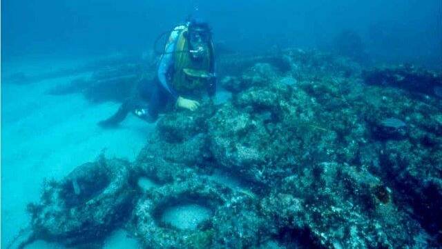A diver exploring what's left of the Walter Hood wreckage. Picture by the Australian Maritime Museum.

