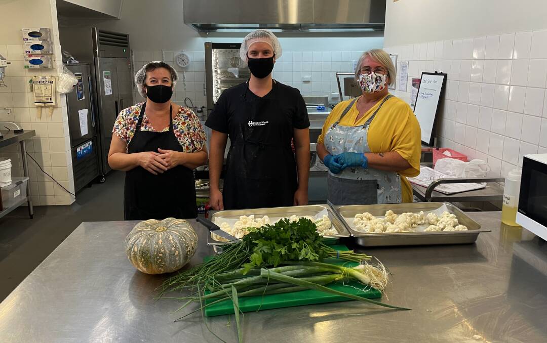 NEVER ENOUGH COOKS IN THE KITCHEN: From left, Sally Martin (Volunteer), Nathan Dimitrievich (Volunteer), Sally Walker (Head Chef). Photo: Sam Baker