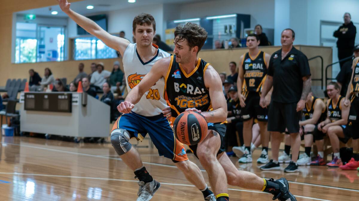 Brayden Morris (right) in action for the Shoalhaven Tigers last season. Picture by Shoalhaven Basketball Association.