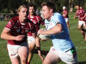 FIELD OF PLENTY: Jamberoo centre Kurt Field tries to get outside his opposite number Cooper Tunbridge during Saturday's clash at Kevin Walsh Oval. Picture: Brian Scott