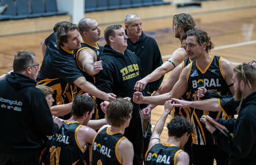 CLAW BACK: The Tigers during a time-out last weekend against the St George Saints. Picture: Shoalhaven Basketball Association.