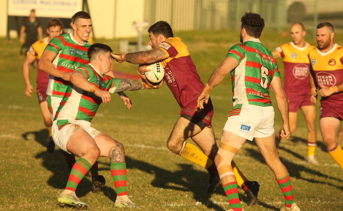 Shellharbour Sharks second-rower James Ralphs tries to get between three Jamberoo defenders during Saturday's thriller at Kevin Walsh Oval. Picture: Kiara Foye 