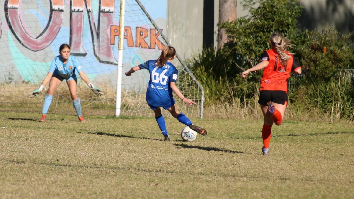 TURNING THE CORNER: U20s April Rowley beats her defender to get a shot on goal. Picture: SCOTT JOHNSON
