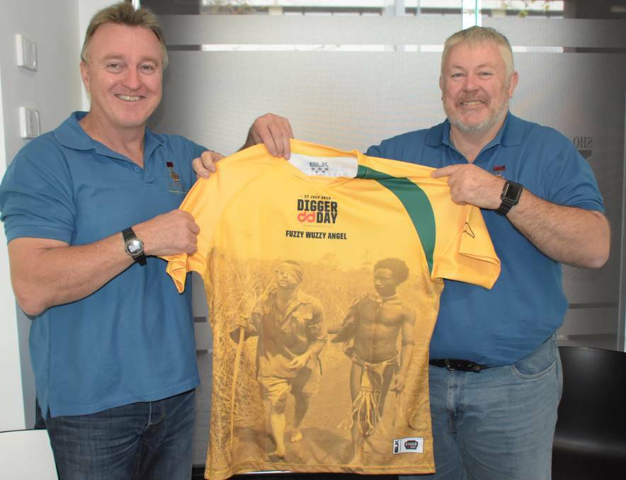 Keith Payne VC Veterans Benefit Group chairman Rick Meehan (left) and vice-chairman Fred Campbell show off this year's Digger Day jersey. Picture: Robert Crawford. 