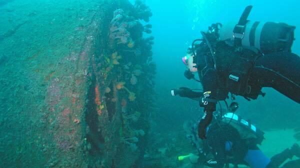 A diver looking at the boiler of the TSS Wandra. Picture by Michael McFadyen