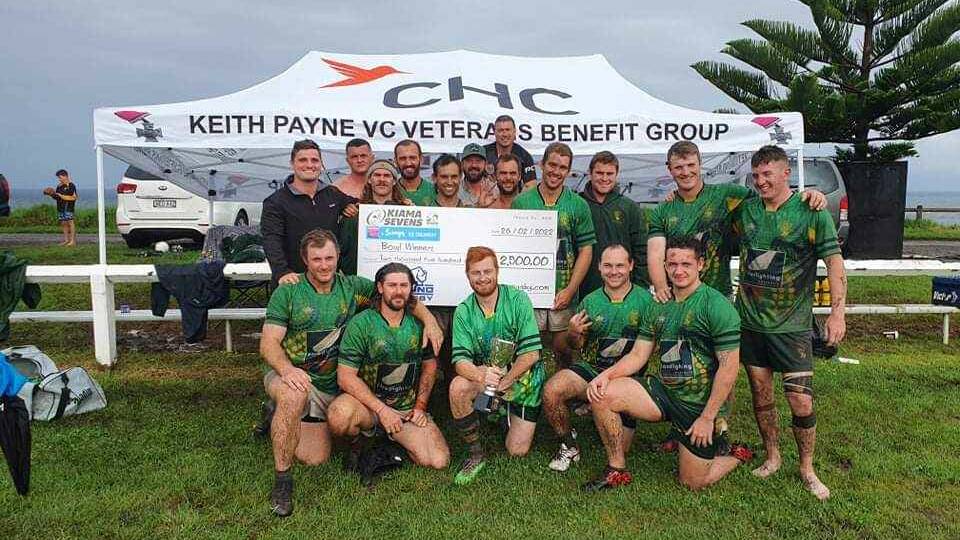 WINNERS GRIN: The Shoalhaven side posing with their winnings at the Kiama Sevens tournament. Photo: Supplied. 