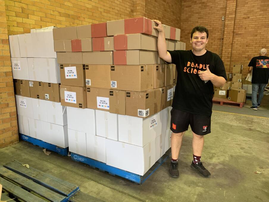 Deadly Science CEO Corey Tutt with boxes of resources bound for schools. Picture: Supplied