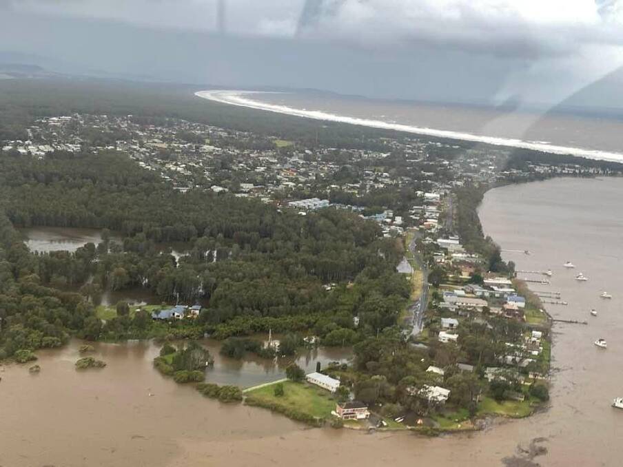 CUT OFF: Shoalhaven Heads is now isolated by floodwaters; road inspectors are due to check conditions again this morning. Picture: Max Cochrane.