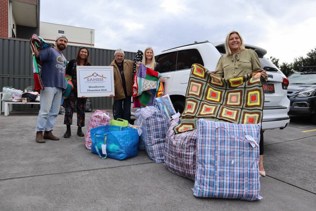 WRAPPED UP: Joey Winkler and Kate Brookes of SAHSSI Homeless Hub received over 300 blankets from Claire Nunn and Tara Finch of First National Shoalhaven Heads. Picture: Jorja McDonnell