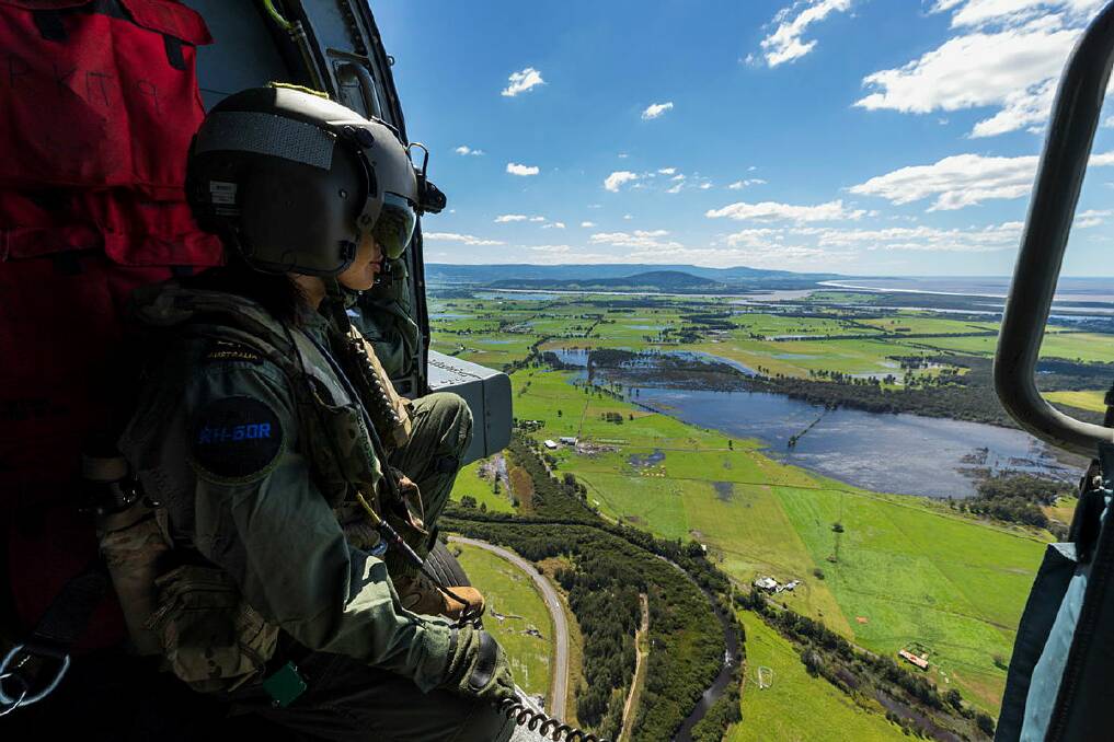 Petty Officer Aircrewman Leeann Mumby conducts Search and Rescue training, as part of Operation NSW Flood Assist. Picture: LSIS Jarrod Mulvihill