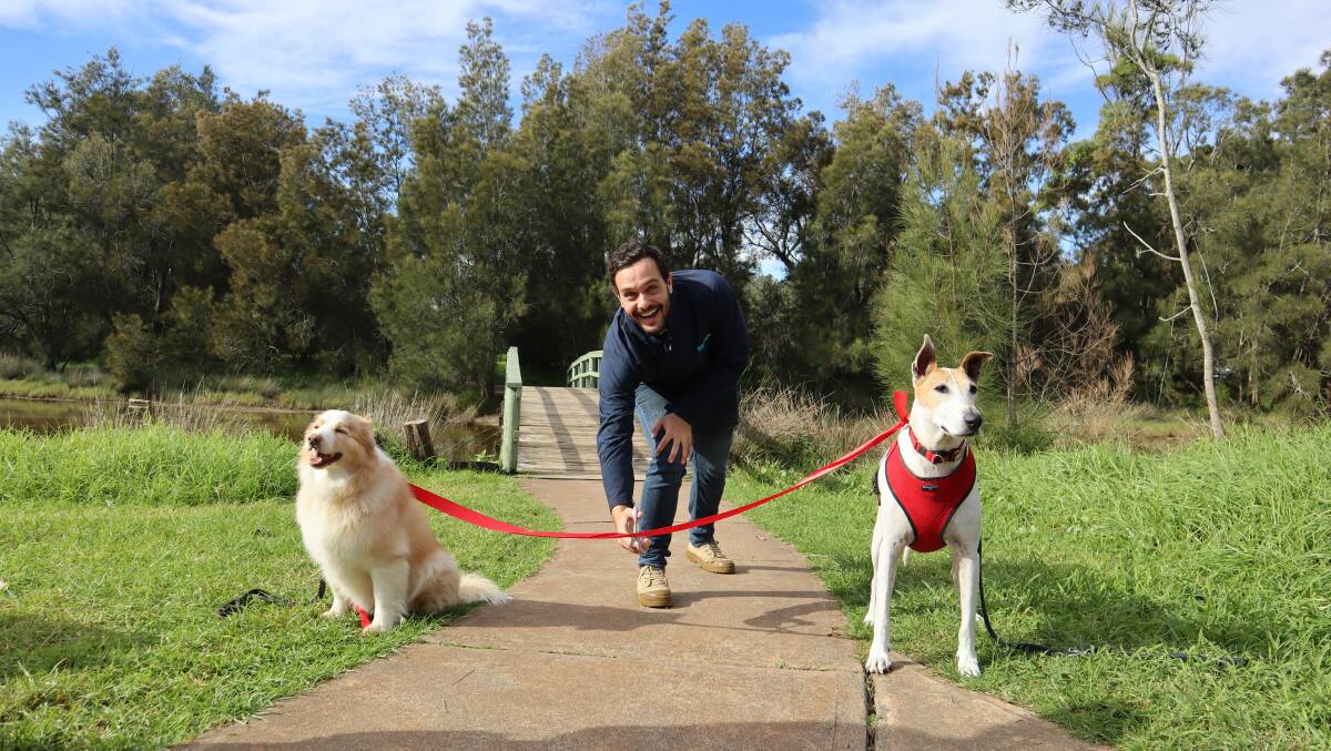 RSPCA Illawarra regional manager Josh O'Donnell officially opened the Shoalhaven Million Paws Walk, ably assisted by Shelby (left) and Bonnie. Picture: Jorja McDonnell.