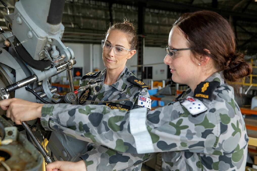 BEHIND THE SCENES: HMAS Albatross is hosting an open day this weekend, giving locals a chance to see the Fleet Air Arm up close. Petty Officer Aviation Technician Aircraft Lauren Carruthers and Able Seaman Aviation Technician Aircraft Courtney Bowkett. Picture: CPOIS Cameron Martin