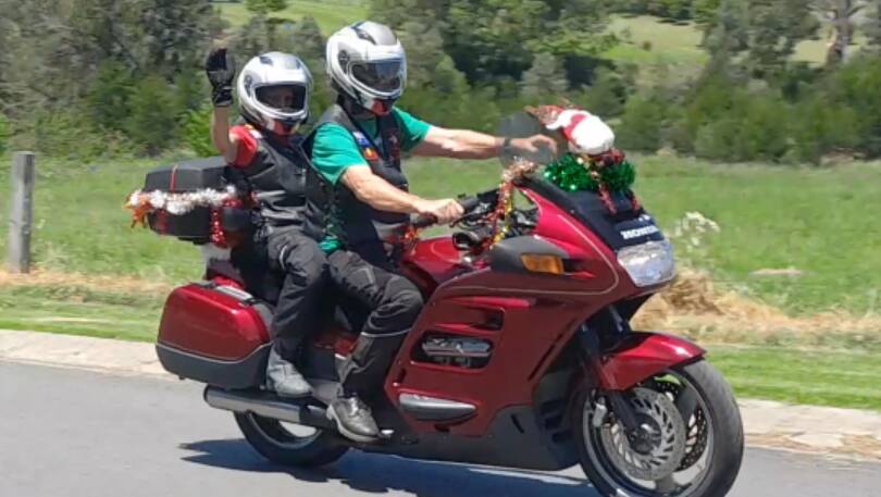 Mez and Andy Crole on their way to Bega for the inaugural Toys for Kids Run last year. Riders and drivers are encouraged to dress up their bikes and cars. Picture supplied