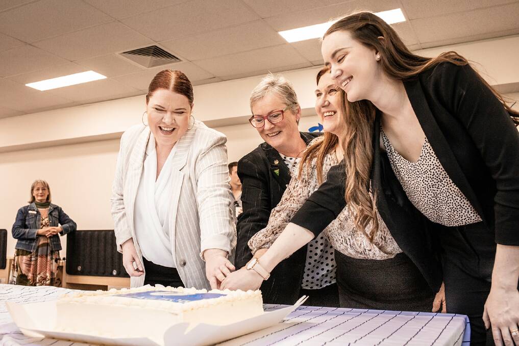 Cutting the cake to celebrate the opening of the Nowra Zig Zag hub. Picture: Supplied. 