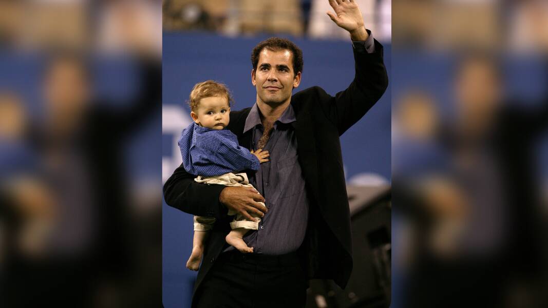 Pete Sampras with his son Christian at the US Open on August 25, 2003. File picture