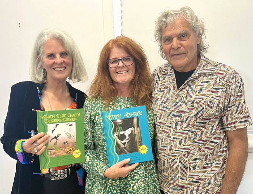 Artist Elizabeth Hawkes with Trish and Noel Butler and the two new children's books. Picture supplied.