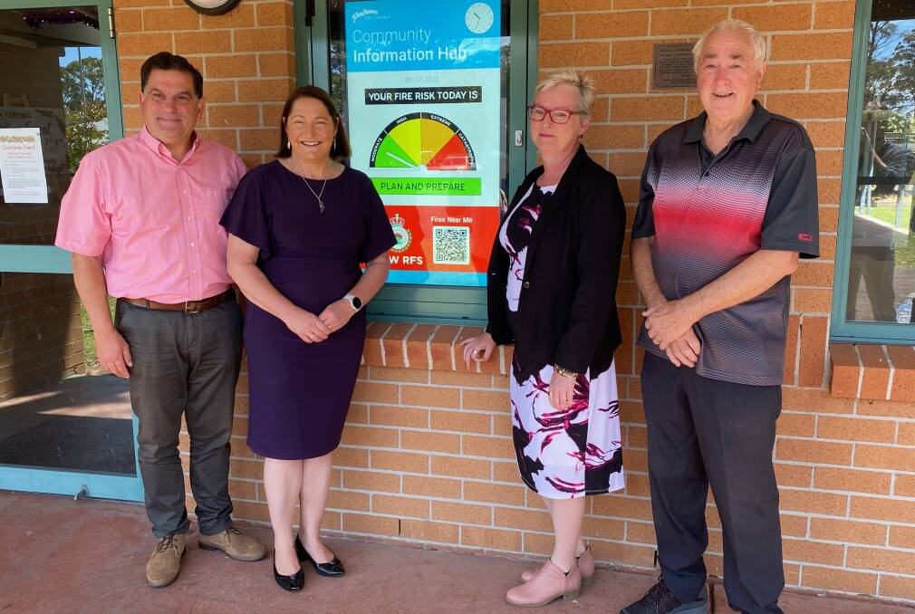 Unveiling the first of the digital information screens in Callala last year were Shoalhaven Recovery coordinator Vince Di Pietro, Federal Member for Gilmore Fiona Phillips, Shoalhaven Mayor Amanda Findley and community member Howard James. Picture by Glenn Ellard. 