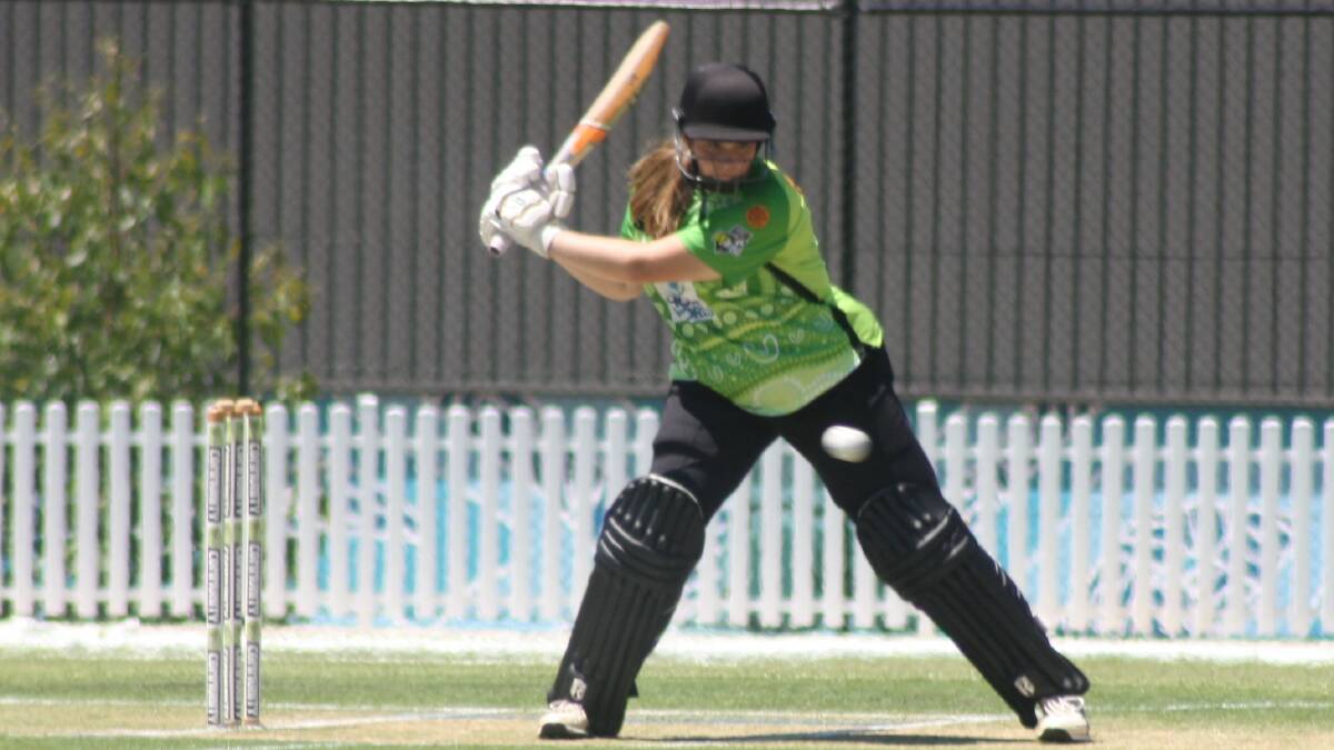 Aimee Ravot from the Sydney Thunder keeps her eye on the ball, ready to hit it onto the off side during the women's T20 game. Picture by Glenn Ellard.
