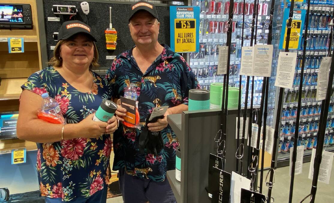 Tracey and Brian Cotterill of Nowra were sorting through the fishing gear during Saturday's Anaconda store opening in Nowra. Picture by Glenn Ellard.