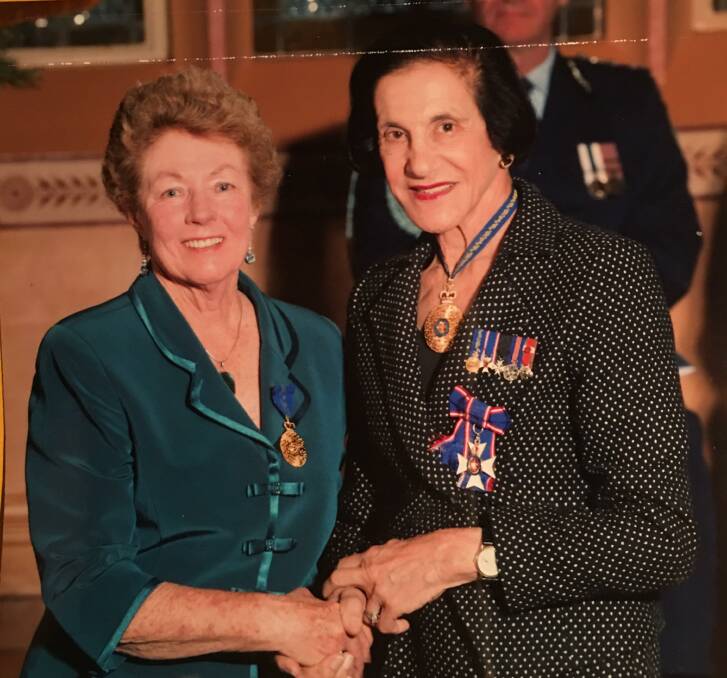 Vera Hatton receives her Order of Australia Medal in 2012 from the NSW Governor, Marie Bashir. Picture supplied.