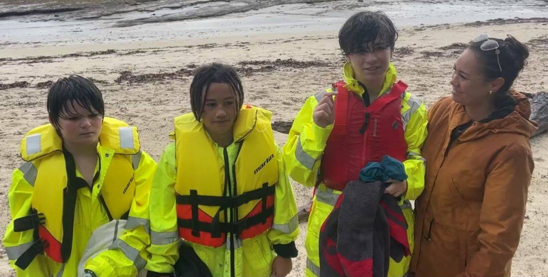 The three boys from New Zealand with their mum Maraea after being pulled from the water off Barfleur Beach. Picture supplied.
