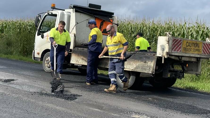 A summit in Ulladulla on Tuesday, June 27 will look at ways to better protect council road workers, such as this crew repairing Greenwell Point Road at Brundee. File photo.