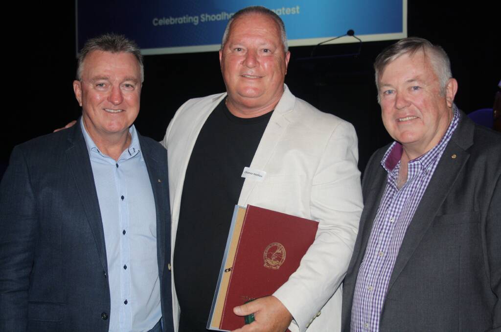 Chance Hanlon (centre) with friends Rick Meehan and Fred Campbell from the Keith Payne VC group, and accepting his Shoalhaven Citizen of the Year award. Picture by Glenn Ellard.