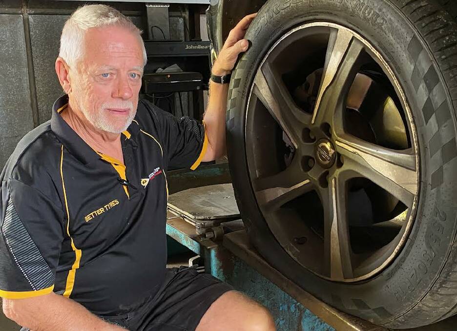 Richard Mahony from Better Tyres in Nowra sets to work replacing a tyre on one of the vehicles targeted in the series of attacks. Picture by Glenn Ellard.