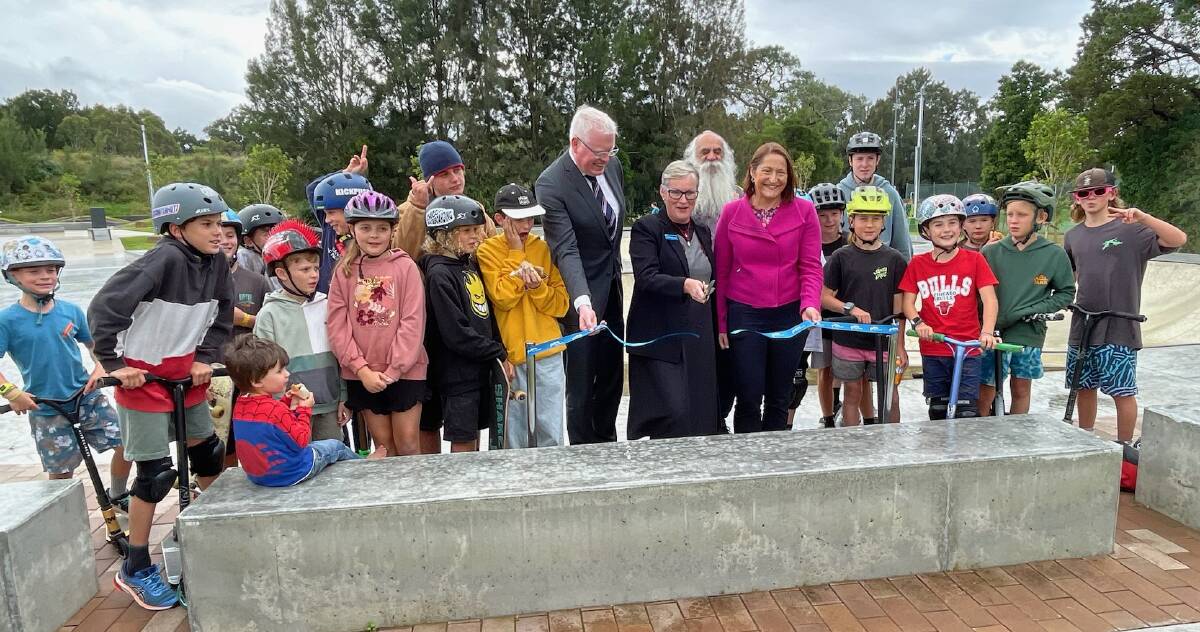 State Member for Kiama Gareth Ward and Federal Member for Gilmore Fiona Phillips are joined by Indigenous elder Paul McLeod and a large contingent of young skate park users to help Shoalhaven Mayor Amanda Findley cut a ribbon to officially open new facilities at Boongaree. Picture by Glenn Ellard.