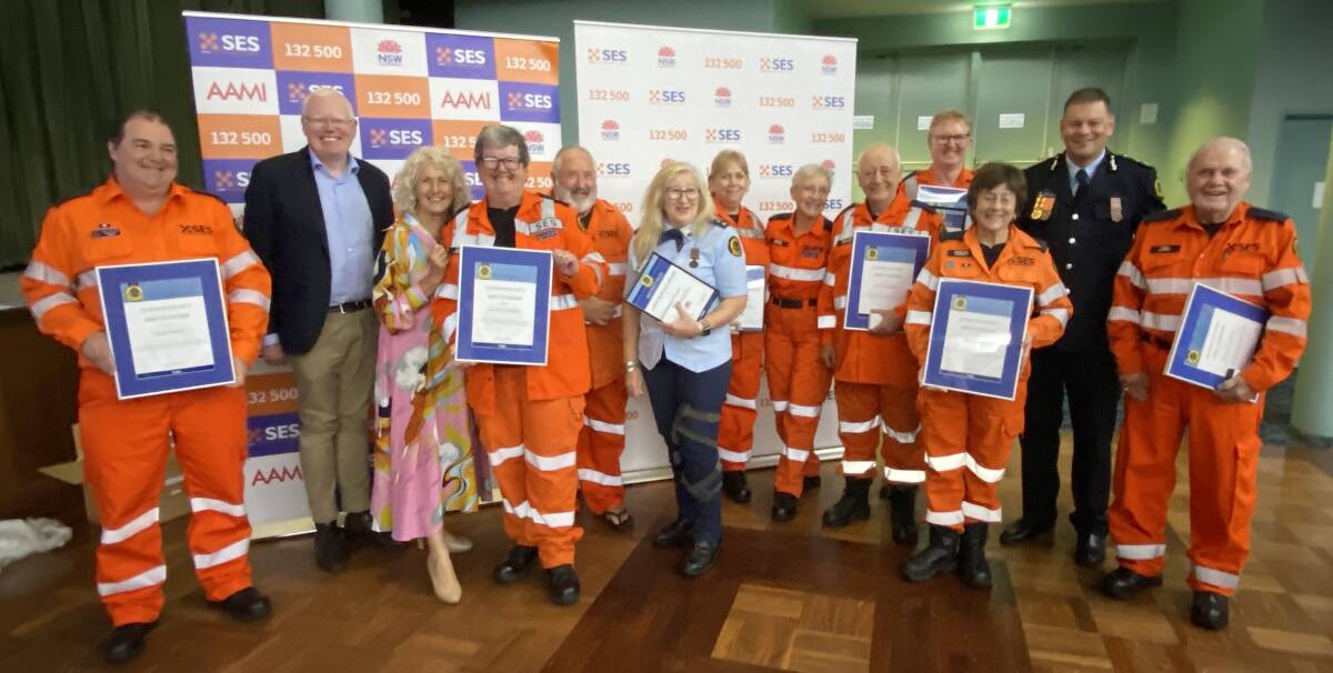 Some of the Ulladulla SES unit members with their awards, pictured with State Member for Kiama, Gareth Ward, State Member for South Coast Liza Butler, and NSW SES Deputy Commissioner Daniel Austin. Picture by Glenn Ellard.