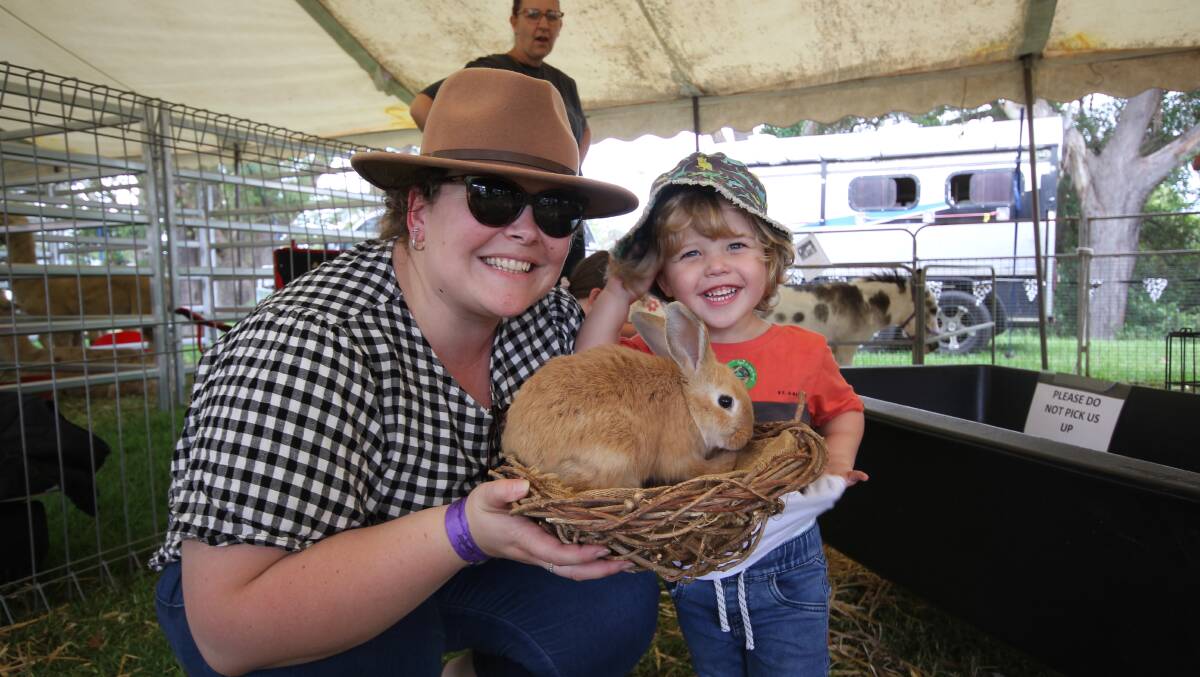 Miranda and Sullivan (2) Roose at the Nowra Show petting zoo on Saturday. Picture by Holly McGuinness 