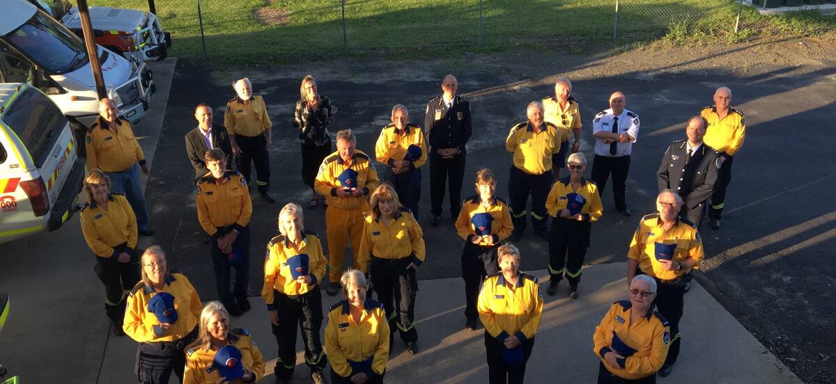 WIRED TO HELP: Members of the Eurobodalla Volunteer Operations Support team and fans on Monday.