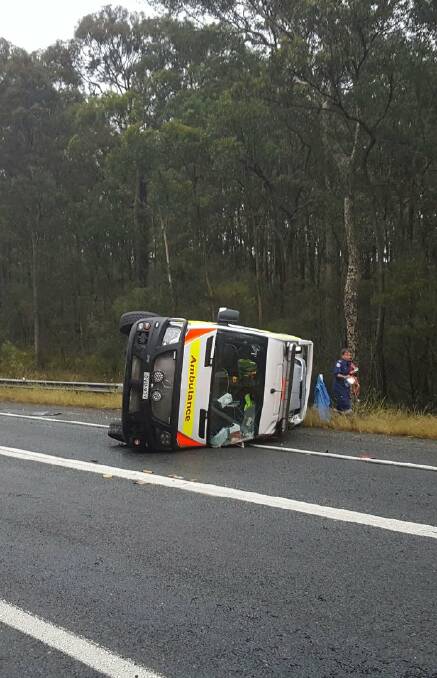 The ambulance overturned while travelling below the speed limit on March 18, witnesses said.