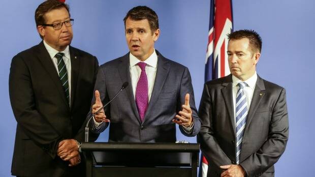 NSW Premier Mike Baird (centre), Deputy Premier Troy Grant (left) and Minister for Local Government Paul Toole announcing proposals late last year. Photo: Dallas Kilponen
