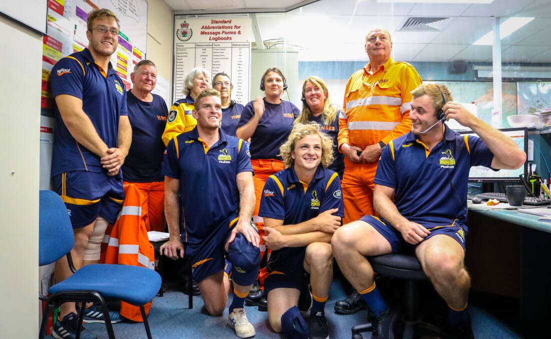 Will Miller (right) and his Brumbies teammates with the NSW Rural Fire Service crew. Photo: Brumbies Media