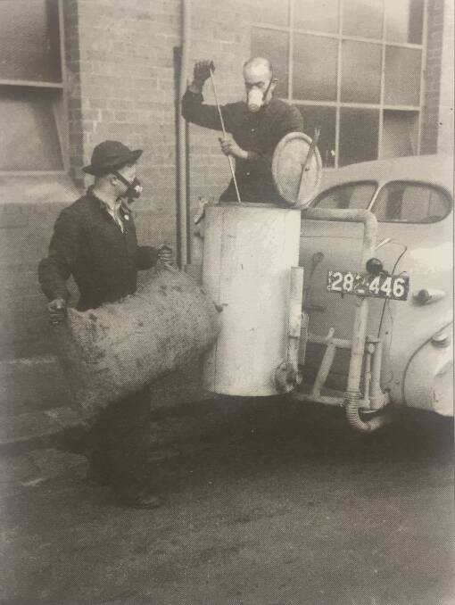 HARD TIMES: Cars were converted so they could be powered by a charcoal burner during WWII, when petrol was scarce. Photo: Australian War Memorial.