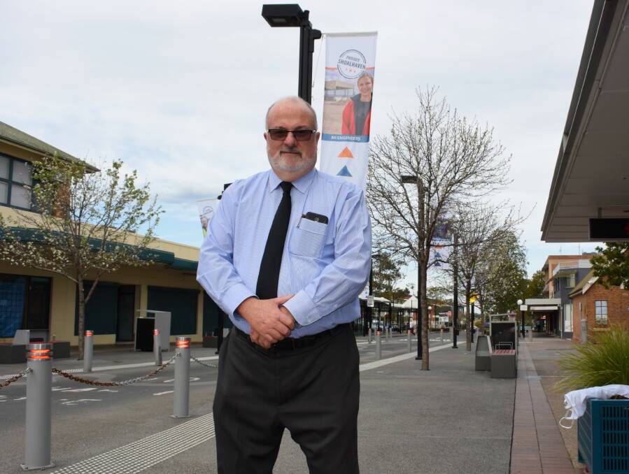 Council’s economic development manager Greg Pullen in Junction Street, where the Proudly Shoalhaven flags are flying. 