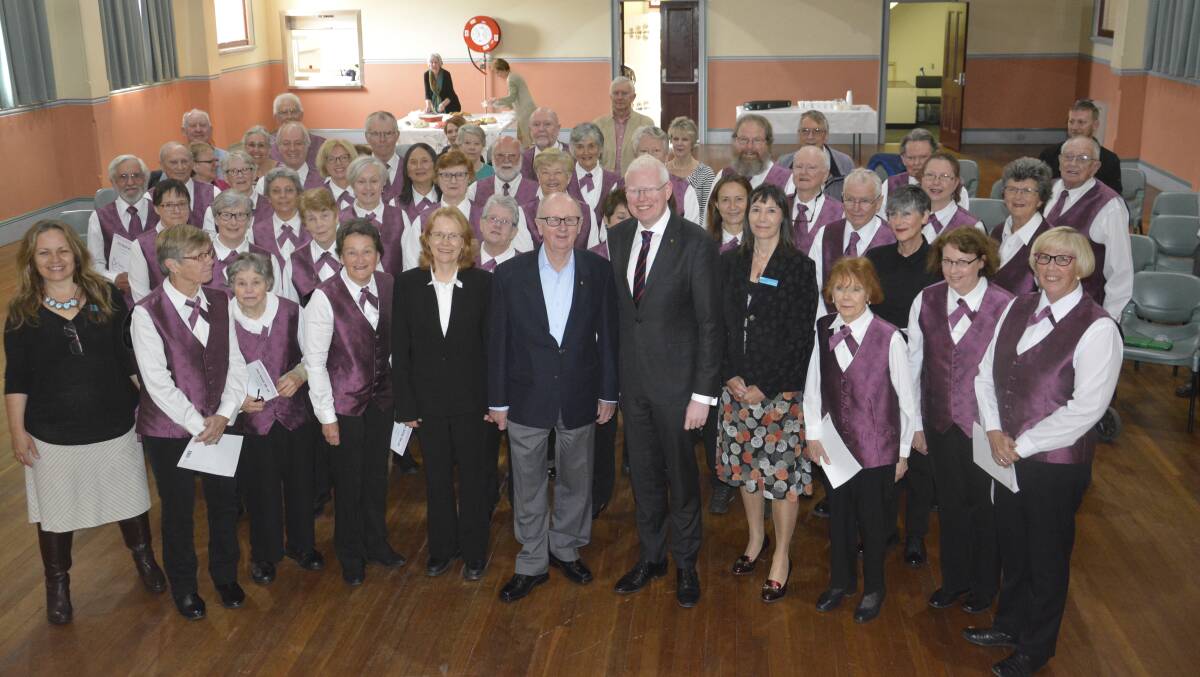 HIGH NOTE: George Windsor and Member for Kiama Gareth Ward with the Lydian Singers. The Nowra School of Arts has received a $10,000 boost for new risers.