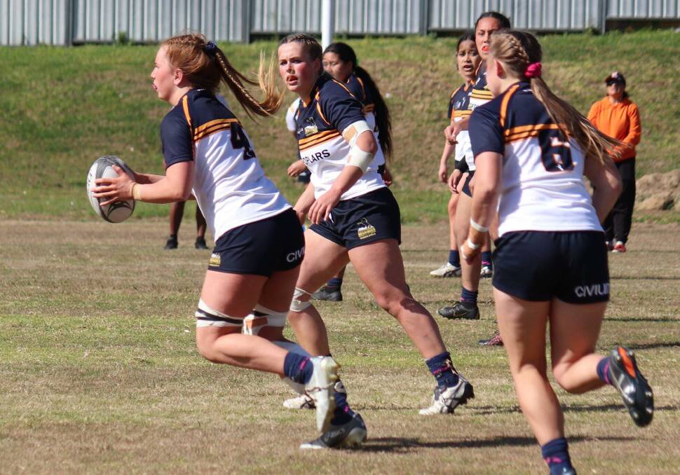 CHARGE: Grace Sullivan (four) makes a run during ACT's drought breaking win against NSW at Narrabeen recently. Photo: BRUMBIES RUGBY