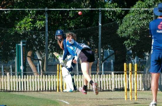 STAR: Chantelle Downey fires down a delivery against an English batter.