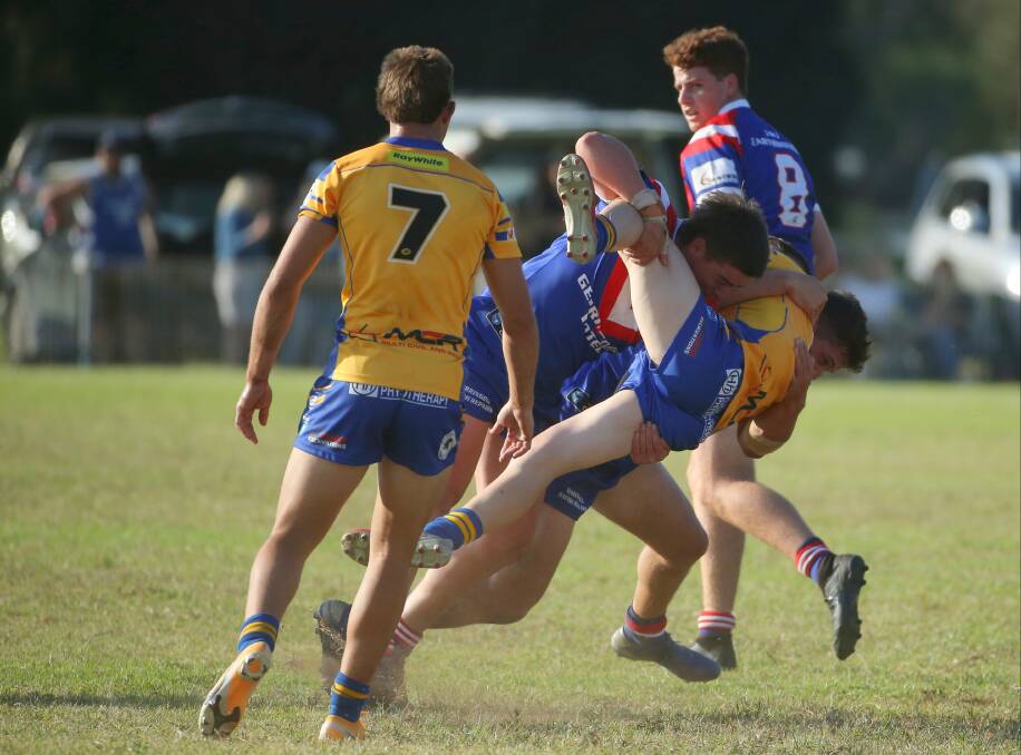 Gerringong's Corey Mulhall tackles a Warilla-Lake South opponent to the ground at Cec Glenholmes Oval this season. Photo: David Tease