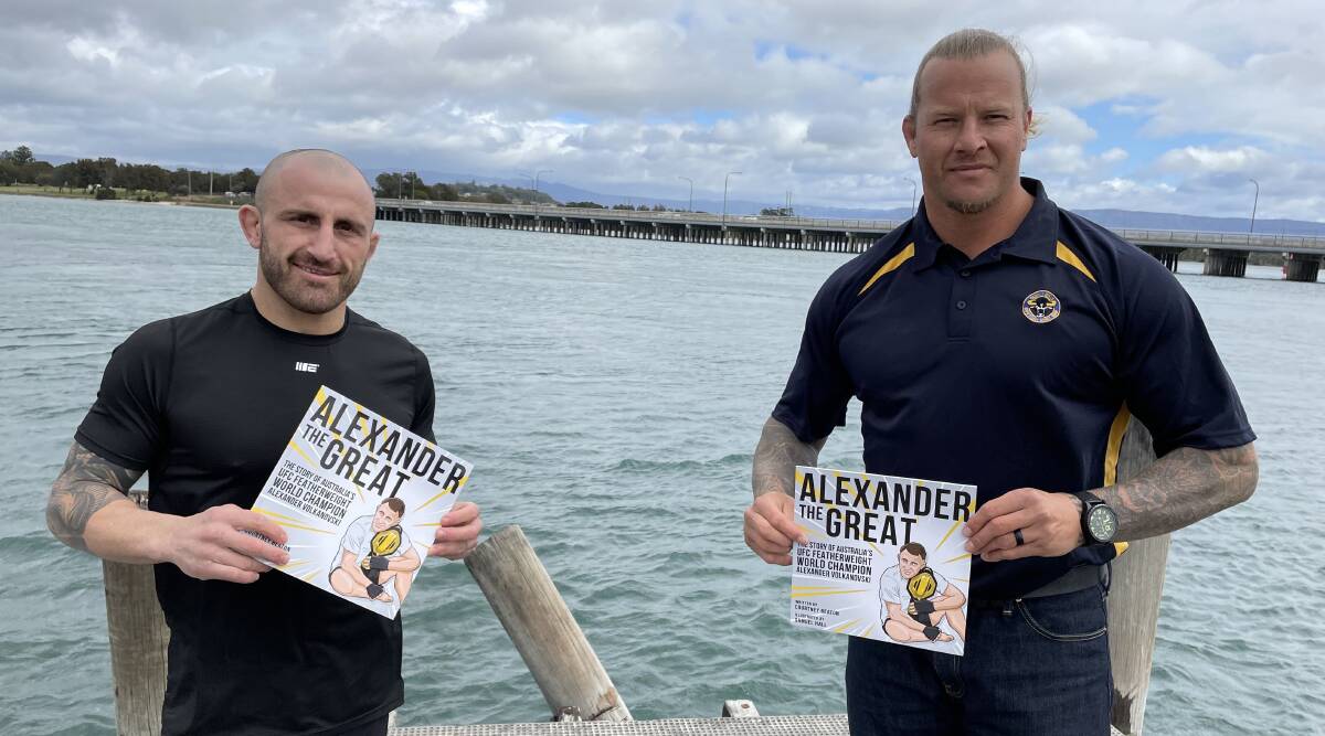 Alex Volkanovski and Ashton Sims with the "Alexander the Great" books which are being donated to Group Seven Rugby League junior clubs. Photo: Courtney Ward