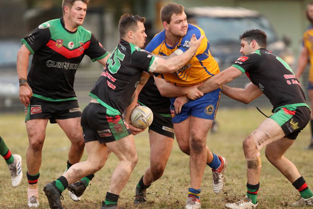Gorillas' Lloyd Thomas gets an offload away against the Superoos. Photo: DAVID HALL