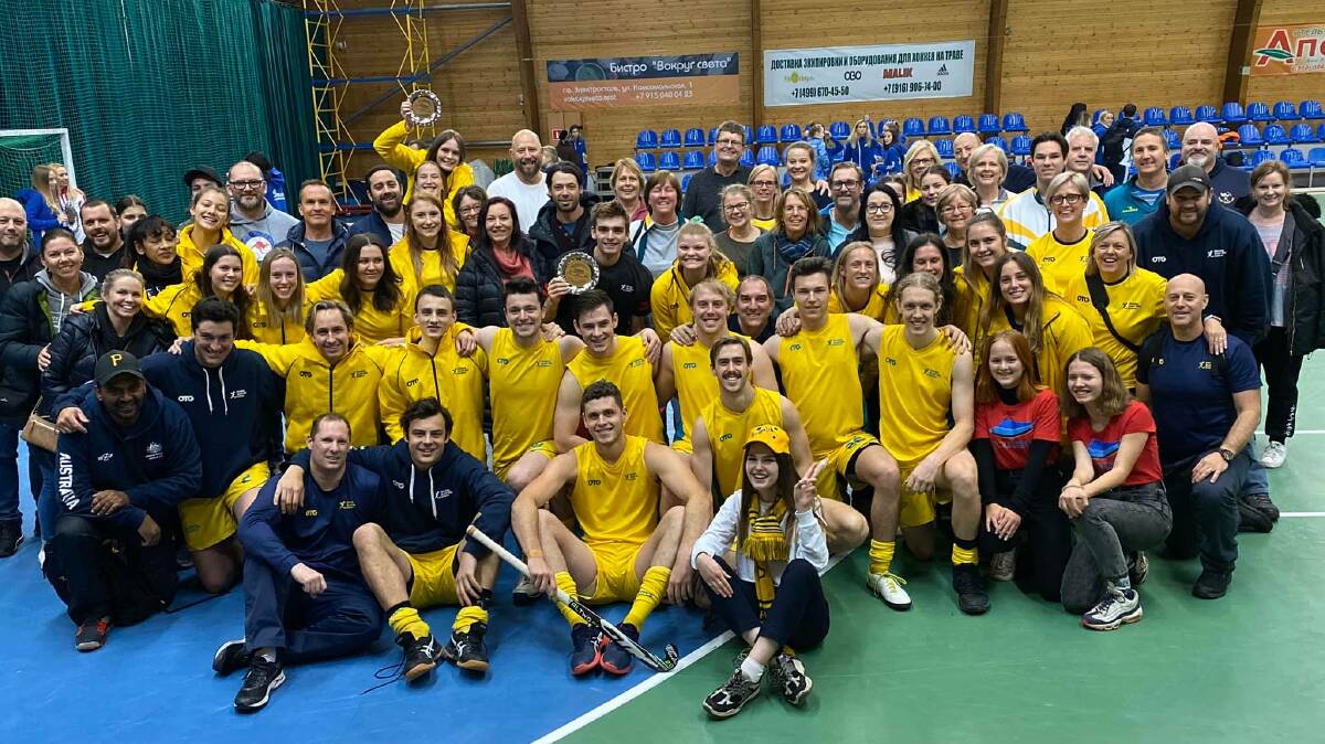 Josh Mayo (front row, third from left) and the Australian under 21s sides in Russia. 