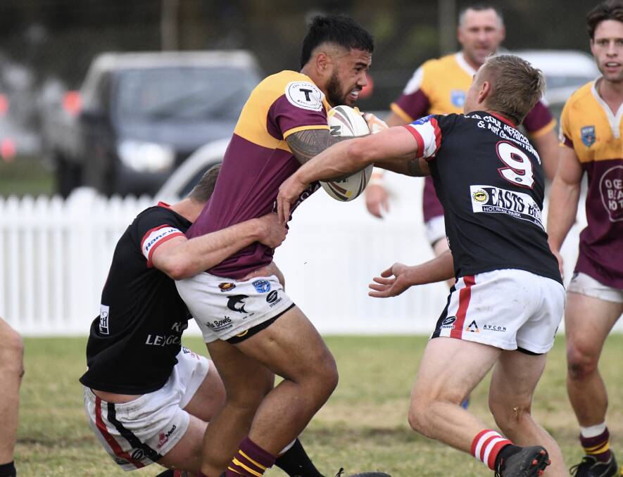 Donte Efaraimo takes a hit-up for the Shellharbour Sharks in 2020. Photo: Kristie Laird