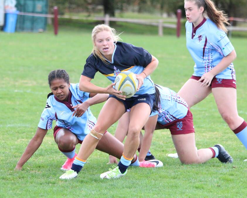Holly Abbey is hoping her form with the Canberra Grammar School under 18s team can lead to higher honours in rugby union. Photo: Karen Abbey