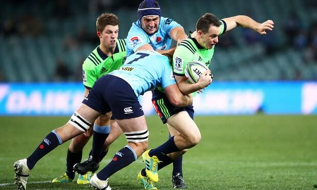 Waratahs' Will Miller (seven) makes a tackle against the Highlanders. Photo: AAP