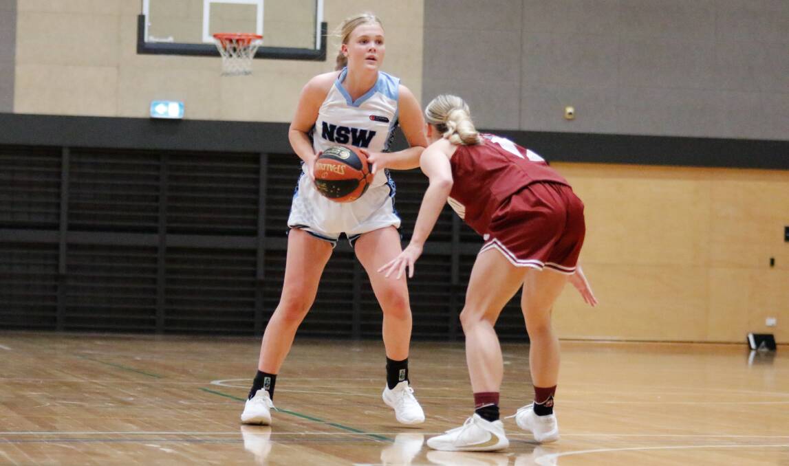 Asha Phillips squares up against a Queensland South opponent. Photo: Jaylee Ismay/Basketball NSW